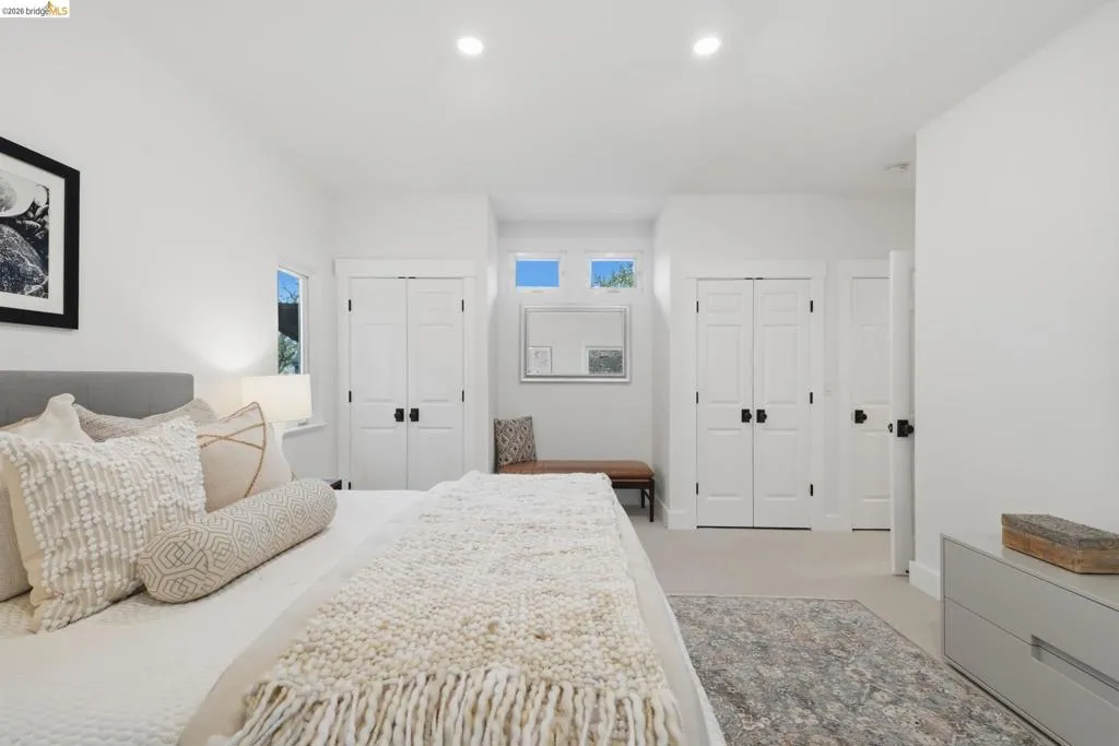 Recessed lighting illuminating the carpeted interior, with white walls and trim throughout Recessed lighting illuminating the carpeted interior, with white walls and trim throughout