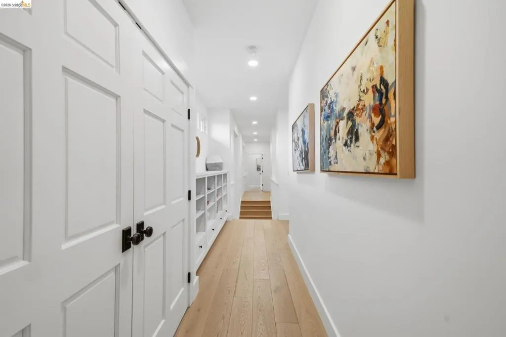 Recessed lighting illuminates wood-finish flooring Recessed lighting illuminates wood-finish flooring