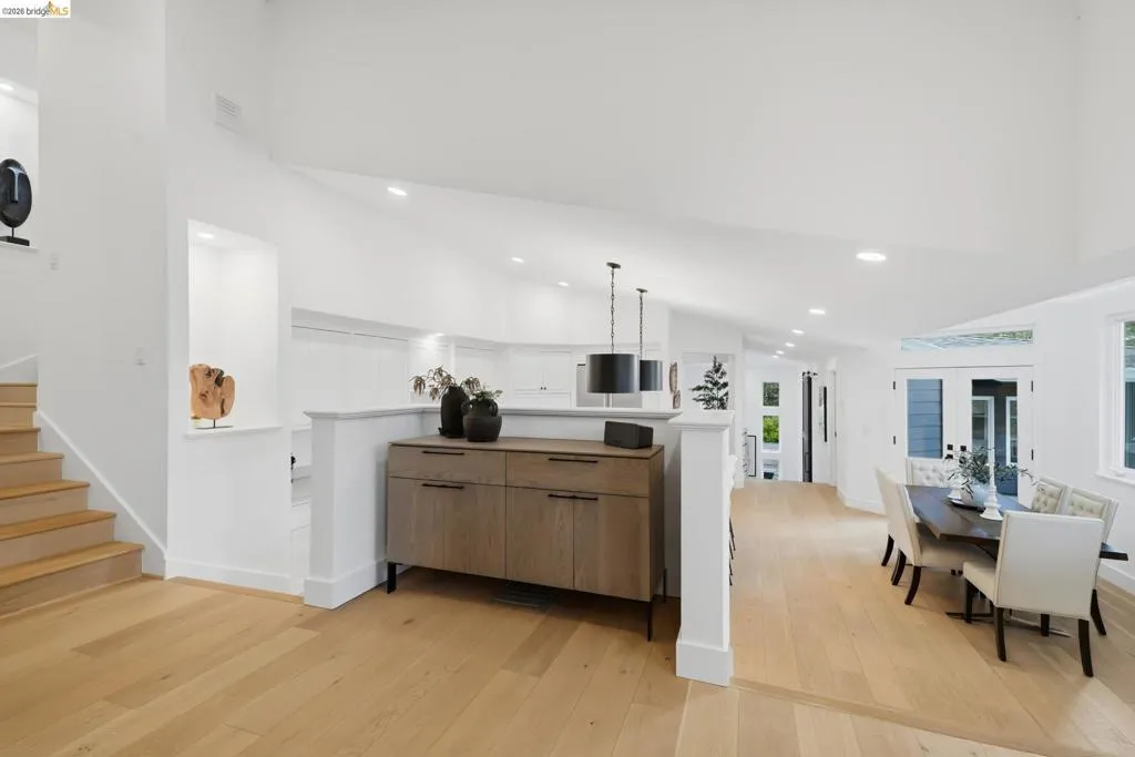 Vaulted ceilings, recessed lighting, and light wood-finish flooring characterize this open concept space Vaulted ceilings, recessed lighting, and light wood-finish flooring characterize this open concept space