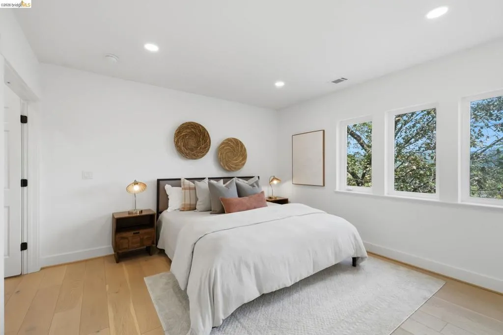 Recessed lighting illuminates wood-finish flooring Recessed lighting illuminates wood-finish flooring