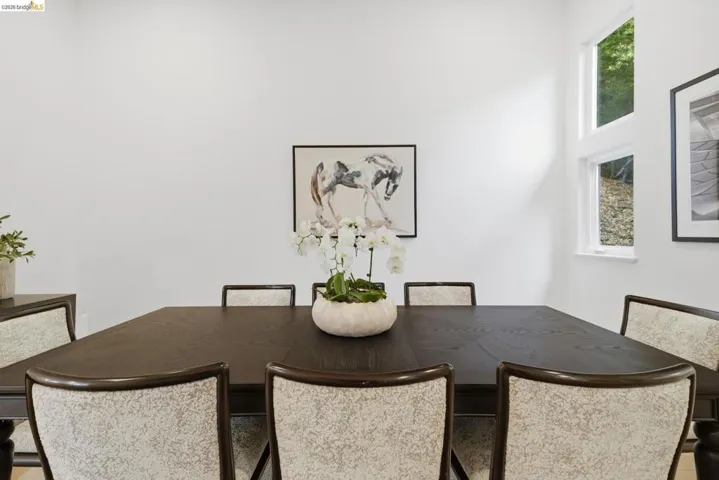 Dining area featuring a dark wood dining table and upholstered chairs
