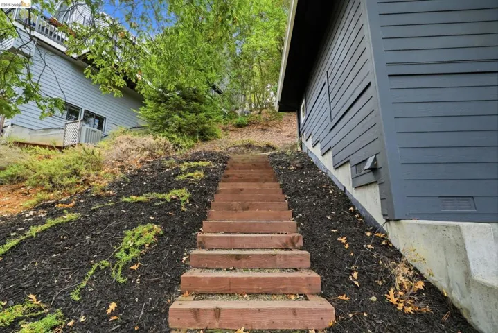 Wood-built exterior steps with landscape mulching