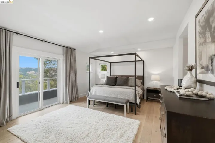 Light wood-finish flooring with recessed ceiling lighting