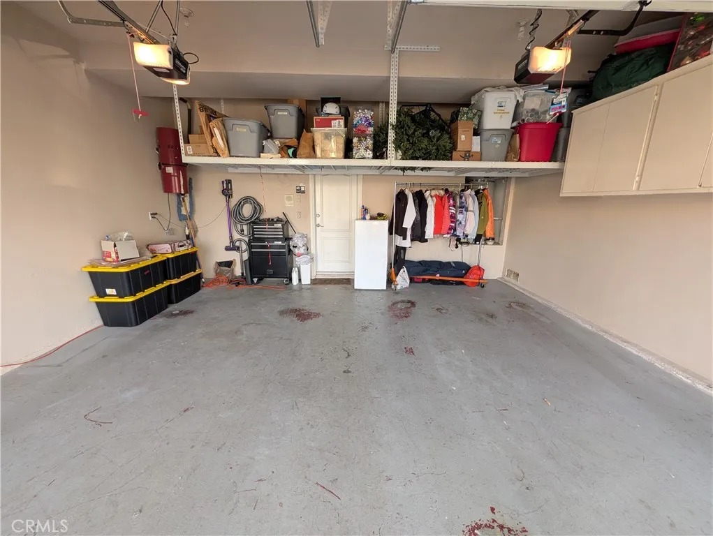 Spacious two-car garage offering ample parking and built in storage.