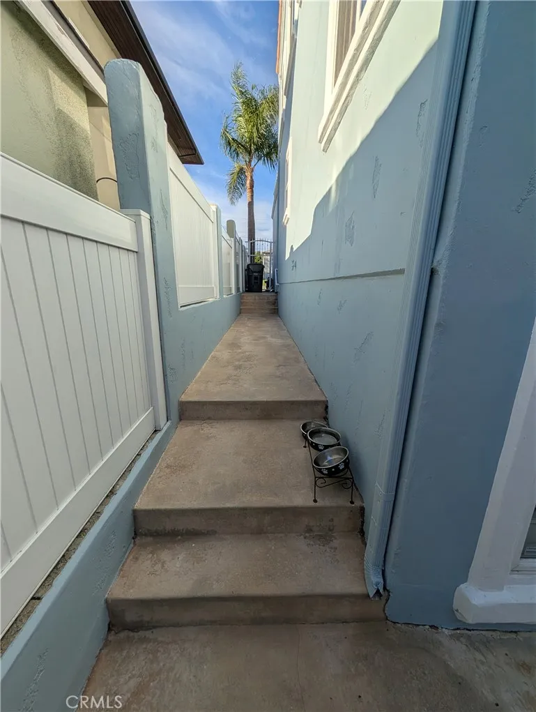 Gated side walkway providing convenient access between the front and rear of the home.