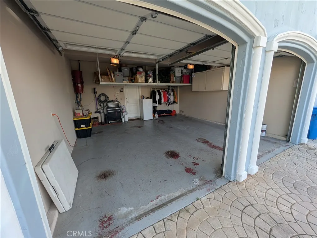 Attached garage with attractive arched openings and convenient direct access to the home.