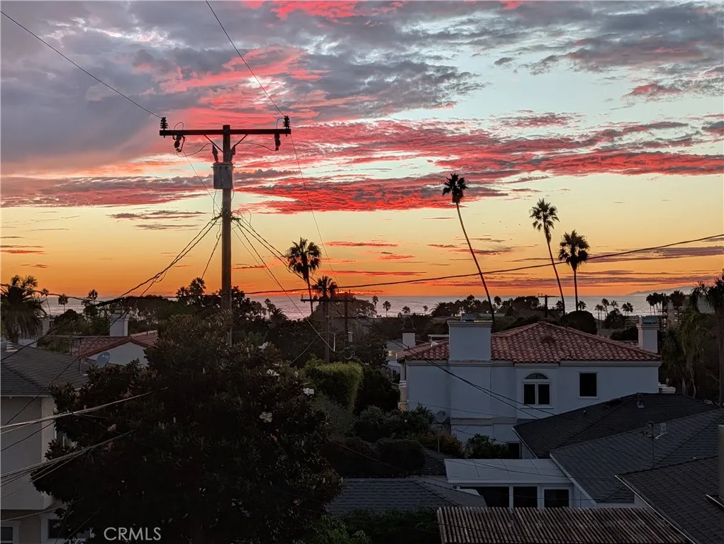 a second breathtaking sunset perspective from primary suite balcony.