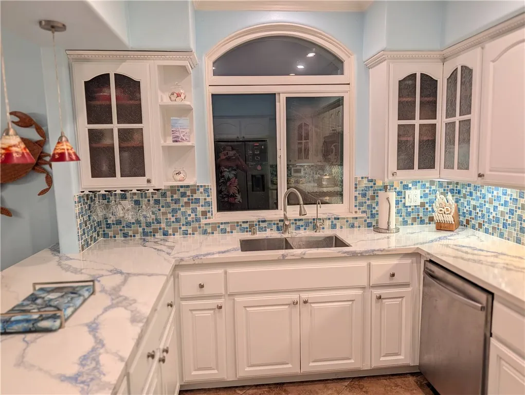 Bright kitchen with windows that fill space with natural light.