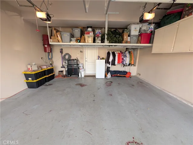 Spacious two-car garage offering ample parking and built in storage.