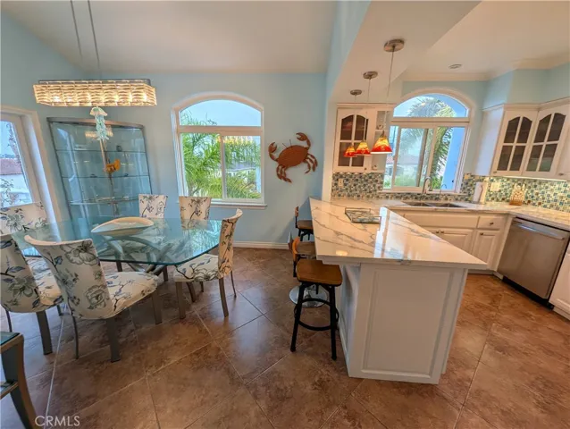 Dining area with tiled floors and seamless access to the kitchen -perfect for everyday meals and entertaining.
