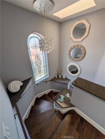 Light-filled staircase with a skylight, creating an attractive connection between the home's three levels.