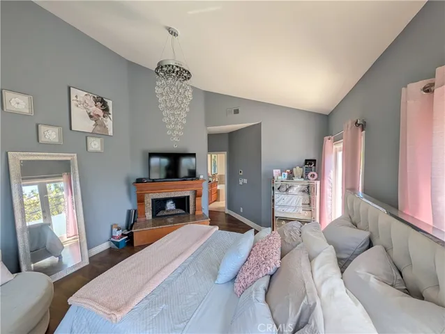 Spacious third-level primary suite featuring high ceilings, abundant natural light and room for a comfortable sitting area.