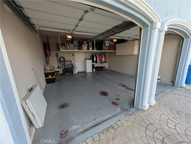 Attached garage with attractive arched openings and convenient direct access to the home.