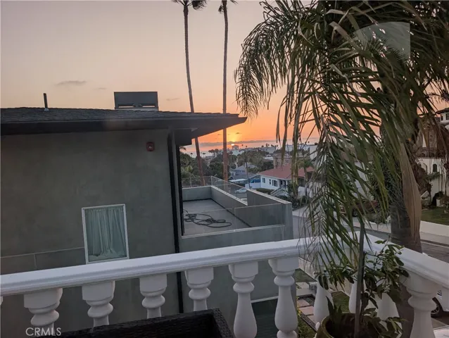 Ocean & palm-tree views from the main-level balcony, creating a relaxing coastal setting.