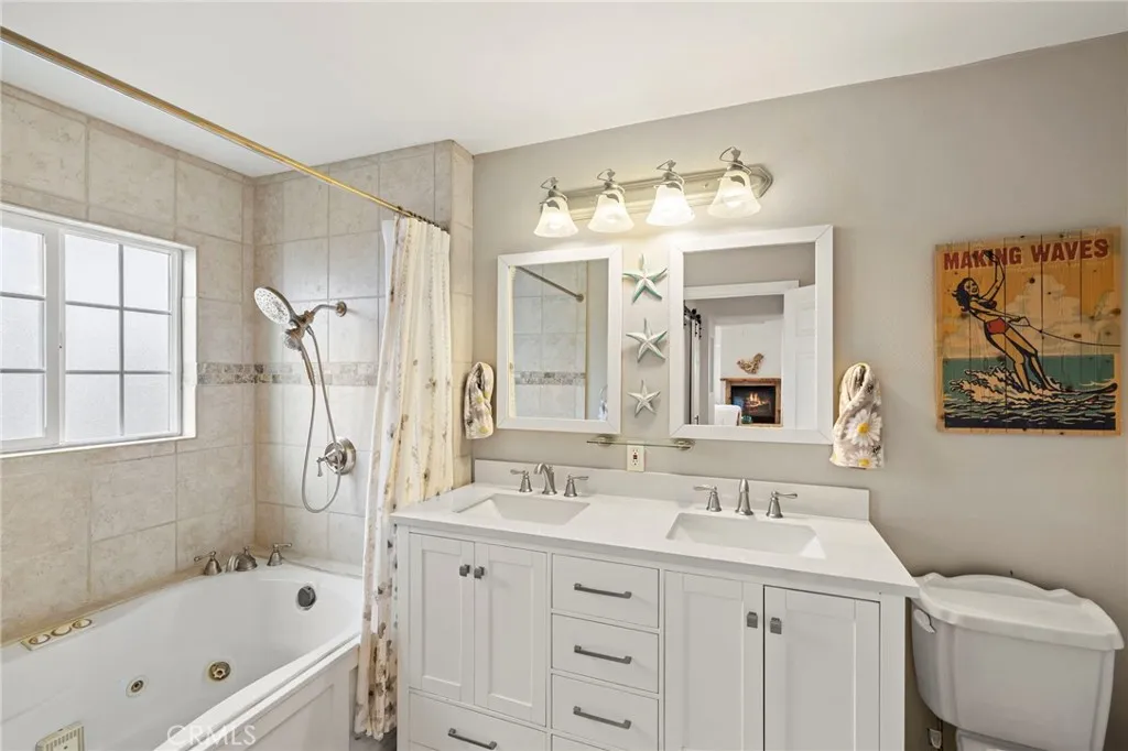 Ensuite Primary Bathroom with Double Sinks and Jetted Tub with Shower