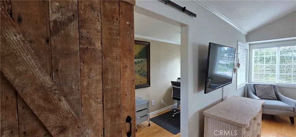 Barn Door Separates Office from Primary Bedroom