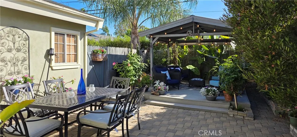 Comfortable relaxing peaceful seating in the beautiful private garden with large patio table and umbrella