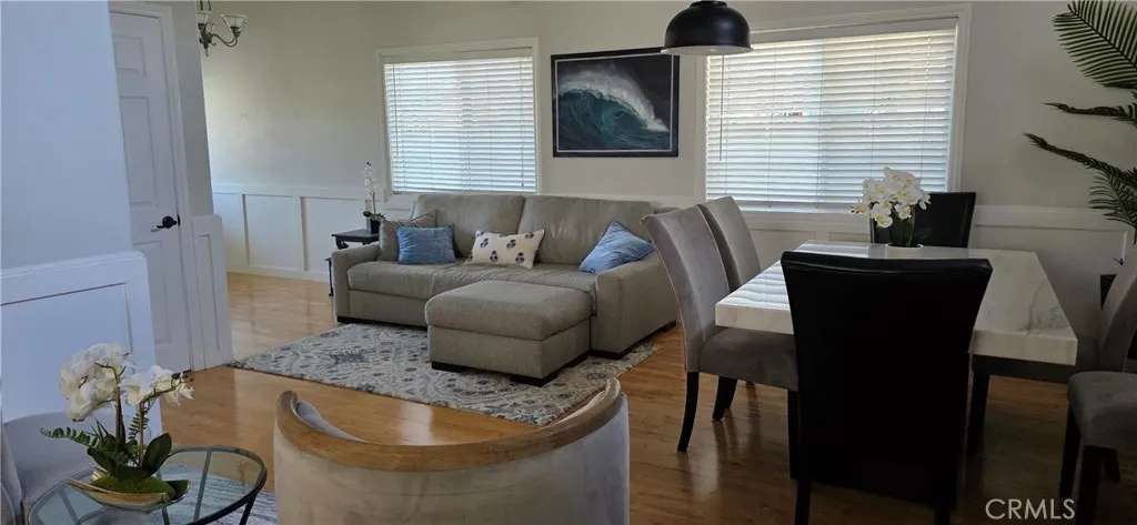 Comfortable Sofa and Barrel chairs in open floor plan.  Sofa can be twin bed.