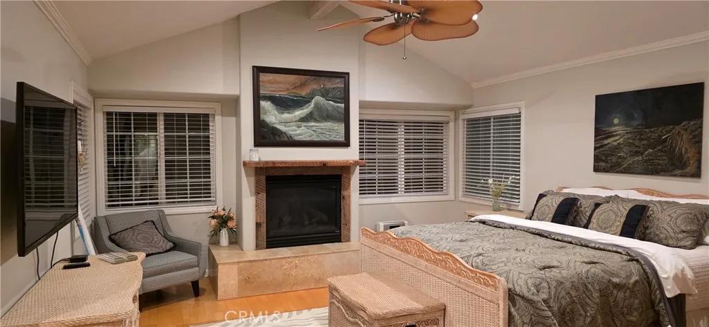 Huge king primary suite with fireplace and large smart TV