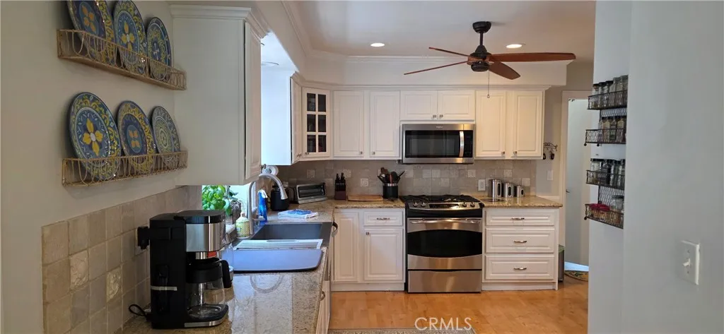 Plenty of Work Space in the Roomy Kitchen with 5 burner Gas Oven, Microwave, and Toaster Oven with Addl Toaster Convection Oven and Air Fryer