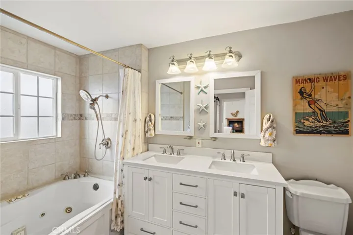 Ensuite Primary Bathroom with Double Sinks and Jetted Tub with Shower