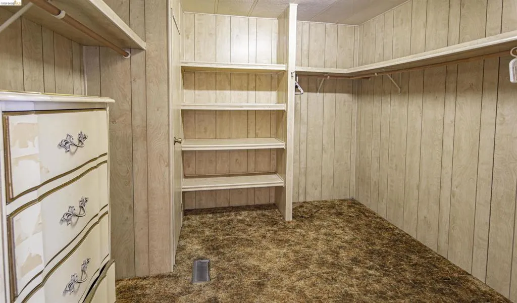 Primary bebroom walk-in closet Primary bebroom walk-in closet
