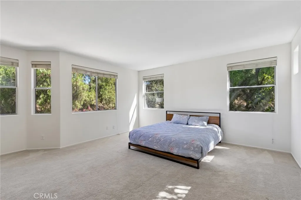 Luxurious primary suite offering a serene and sophisticated retreat.