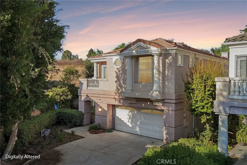Beautifully landscaped outdoor space with lush greenery and inviting curb appeal.
