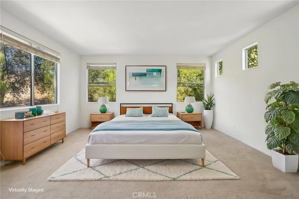 Luxurious primary suite offering a serene and sophisticated retreat.