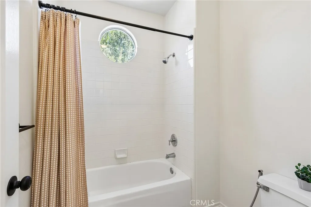 Stylish Jack-and-Jill bathroom connecting two bedrooms with a spacious and functional layout.