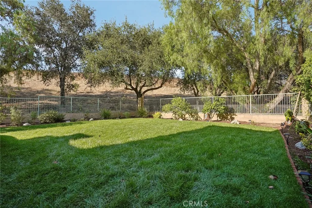 Beautifully landscaped outdoor space with lush greenery and inviting curb appeal.