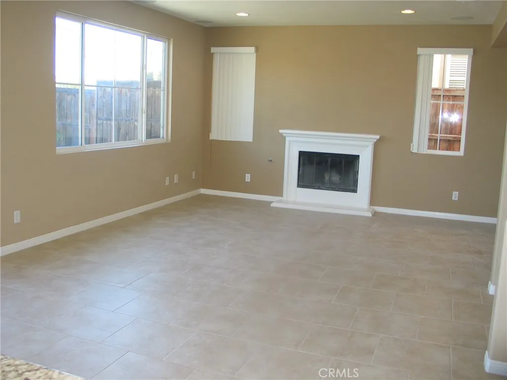 Large family room with warm fire place Large family room with warm fire place