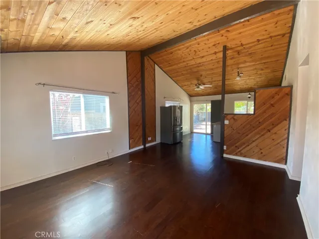 Living area with vaulted ceilings.