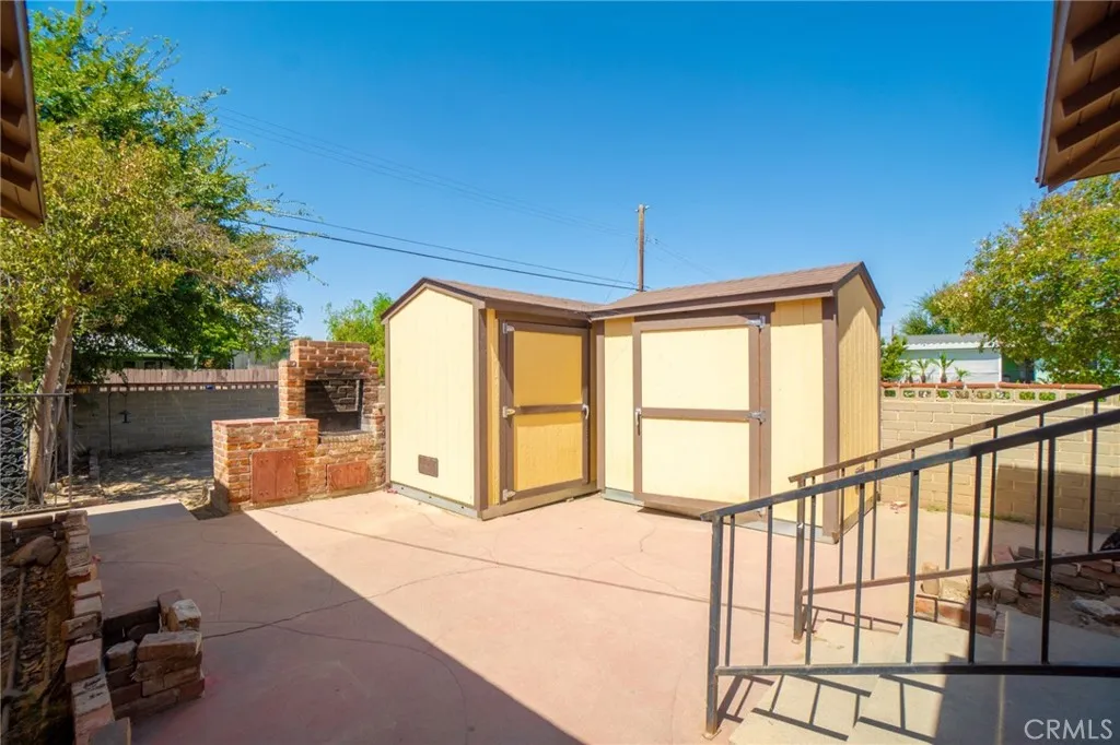 Back patio with storage shed