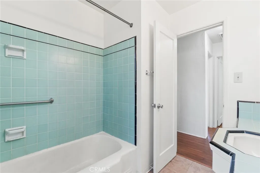 Tub and shower combination with midcentury tile