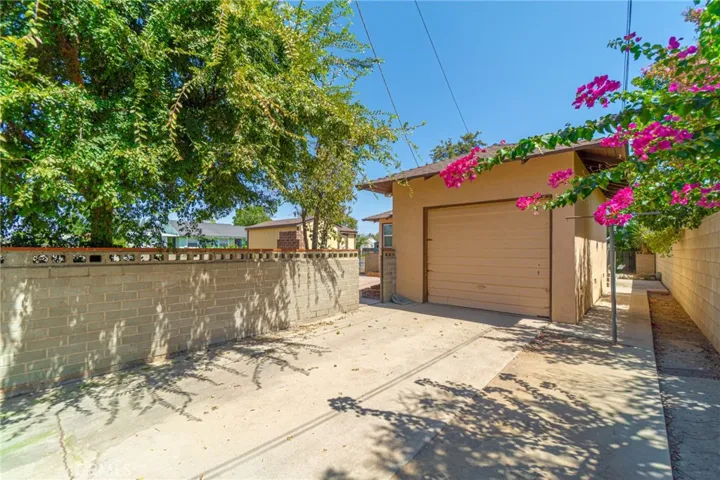 Gated side entry to the attached garage with room for a boat or extra cars
