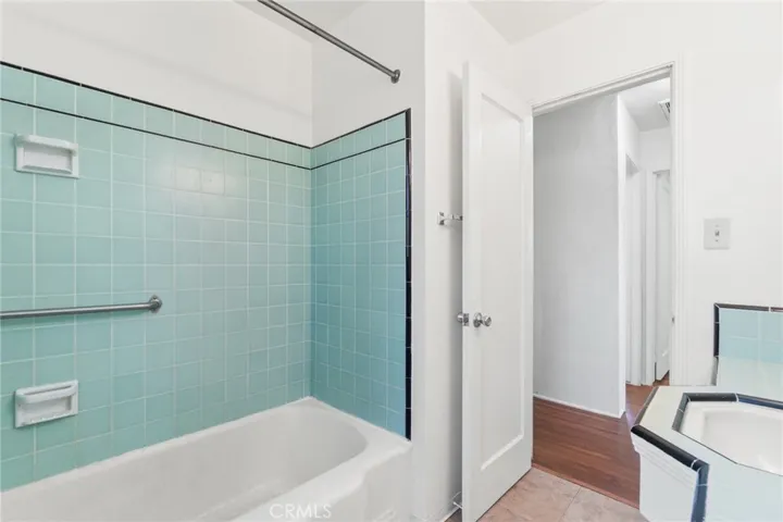 Tub and shower combination with midcentury tile