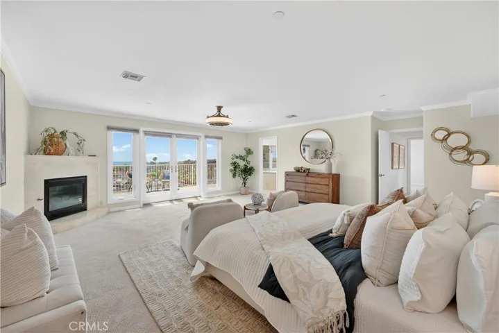 Primary suite with fireplace and ocean views