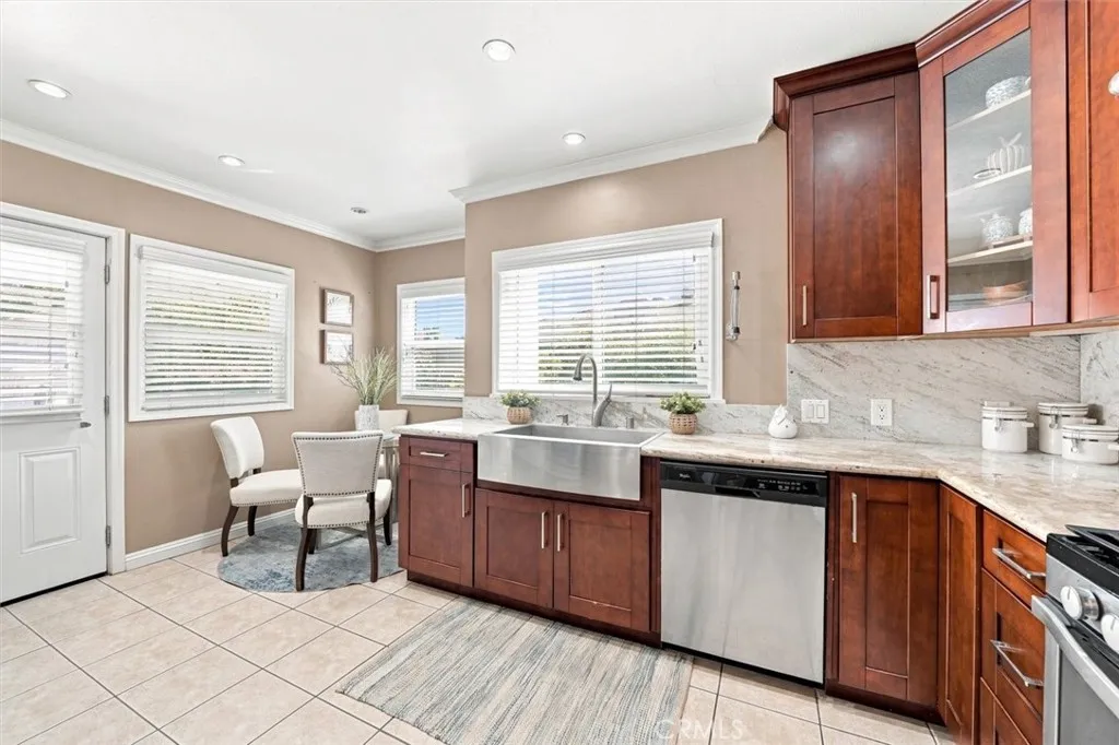 Kitchen with access to backyard, bonus room, and garage via utility door