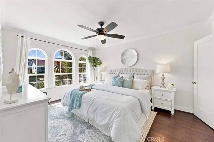 Primary suite with views of front yard and lots of natural light
