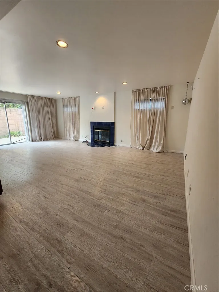 Family room with fireplace and sliding doors to backyard