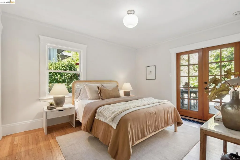 Light-filled room featuring hardwood flooring and white trim Light-filled room featuring hardwood flooring and white trim