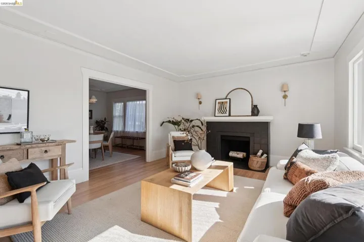 Fireplace featuring a dark tile surround and white mantel
