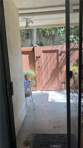 Patio has private gate entrance from garage hi