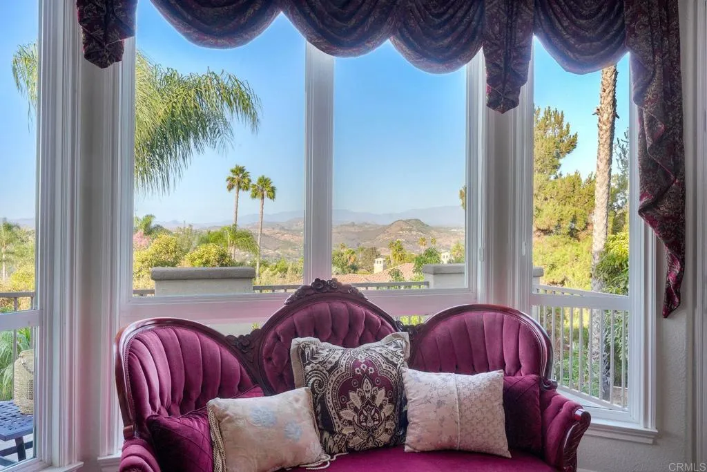 Primary bedroom retreat with stunning views, cozy fireplace & private balcony Primary bedroom retreat with stunning views, cozy fireplace & private balcony