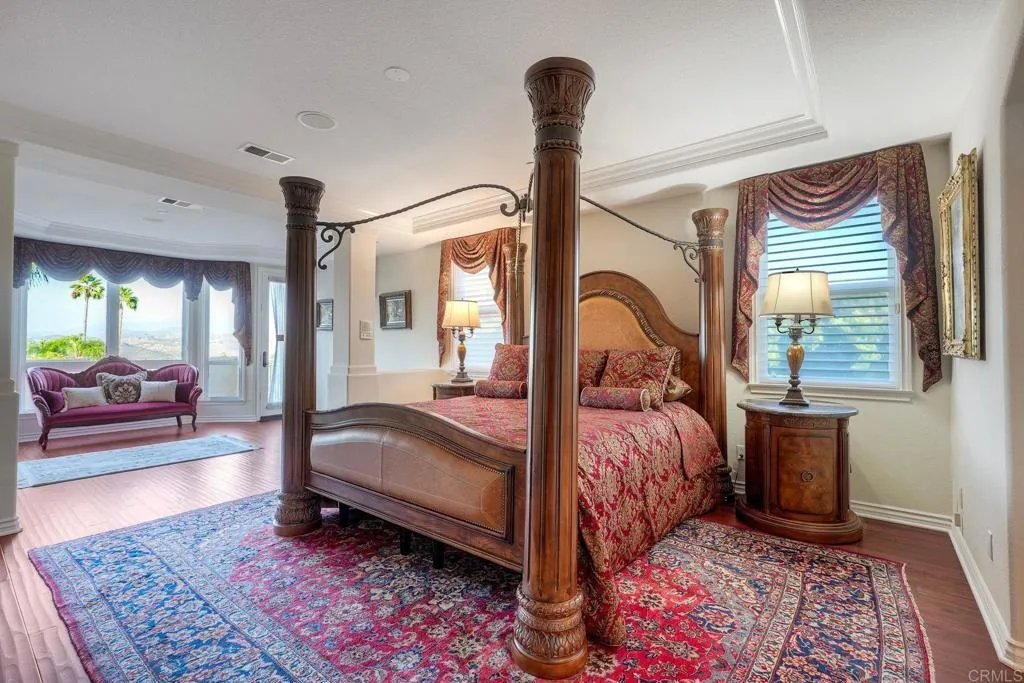 Primary bedroom ensuite with sitting area, cozy fireplace & private balcony Primary bedroom ensuite with sitting area, cozy fireplace & private balcony