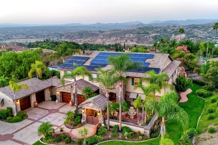 Beautifully manicured landscape & lush lawn surround this home on all sides irrigated by well water!