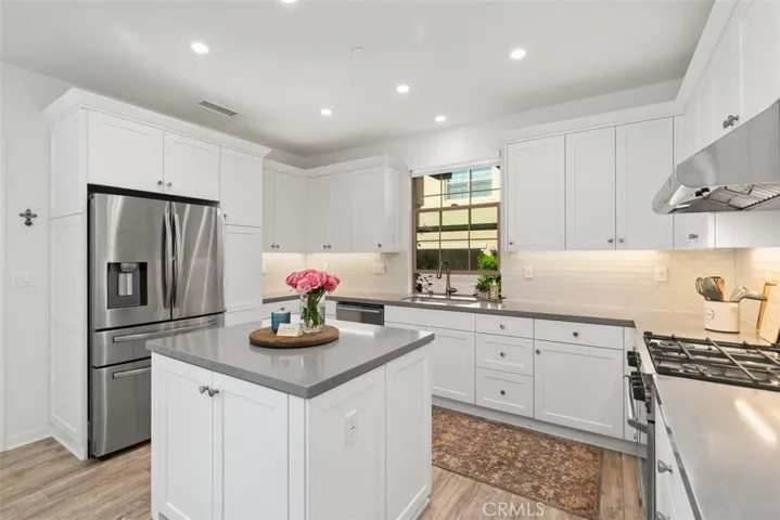 Open concept kitchen, abundant storage and cabinet space; completely refreshed with modern appliances.