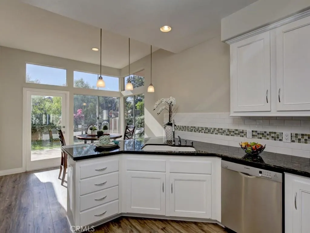Kitchen and nook area opens to a garden patio.