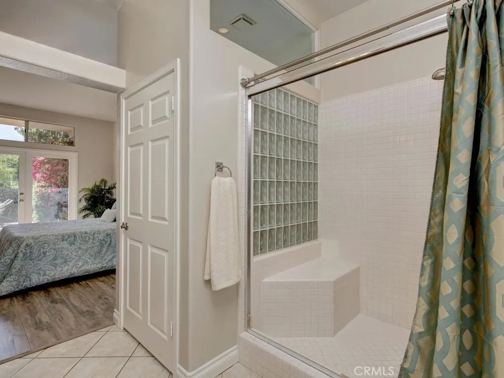 Primary shower with private toilet area